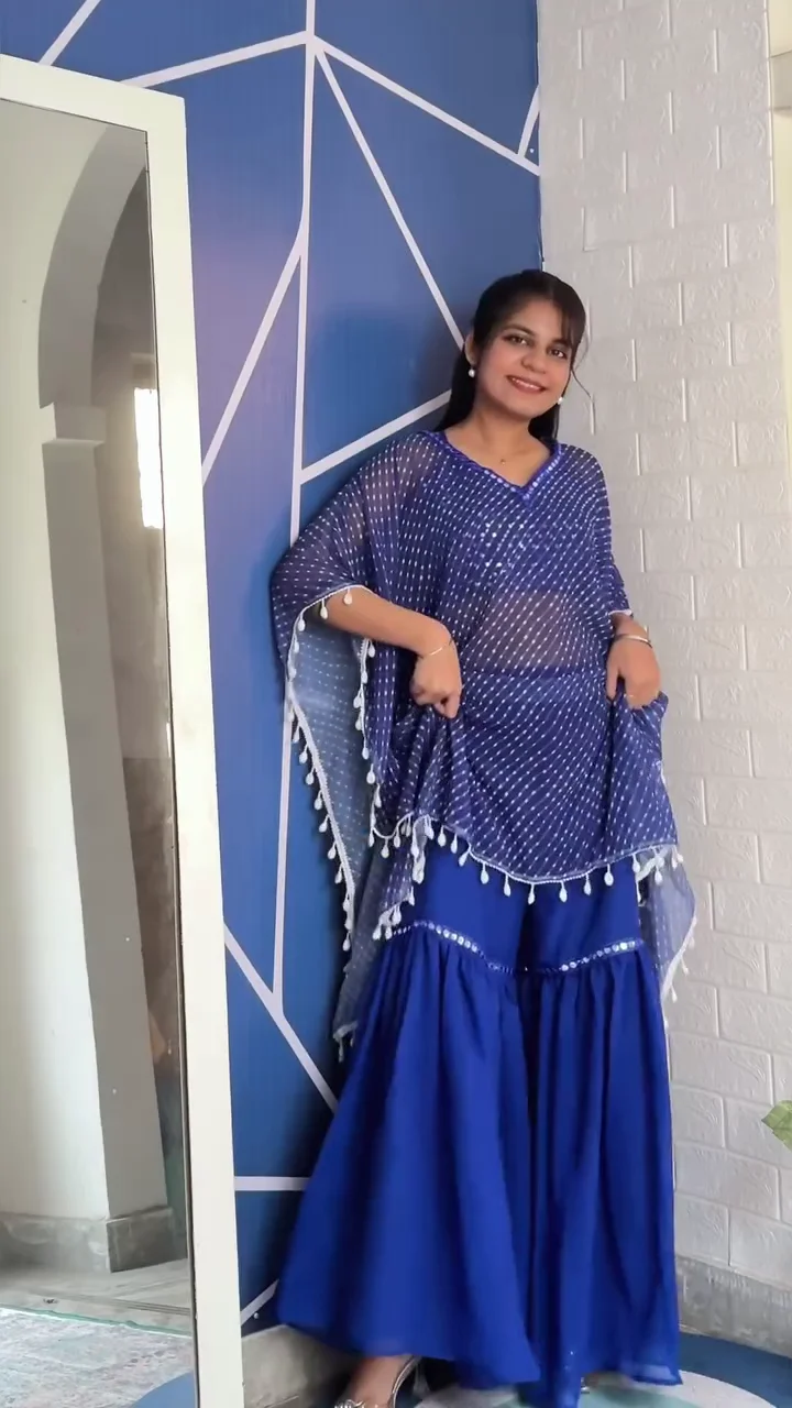 trendy ethnic fusion wear – royal blue sharara set with sheer polka dot poncho and tassel detailing & elegant lavender drape saree with stylish pleated blouse and waist belt trendy ethnic fusion wear – royal blue sharara set with sheer polka dot poncho and tassel detailing & elegant lavender drape saree with stylish pleated blouse and waist belt